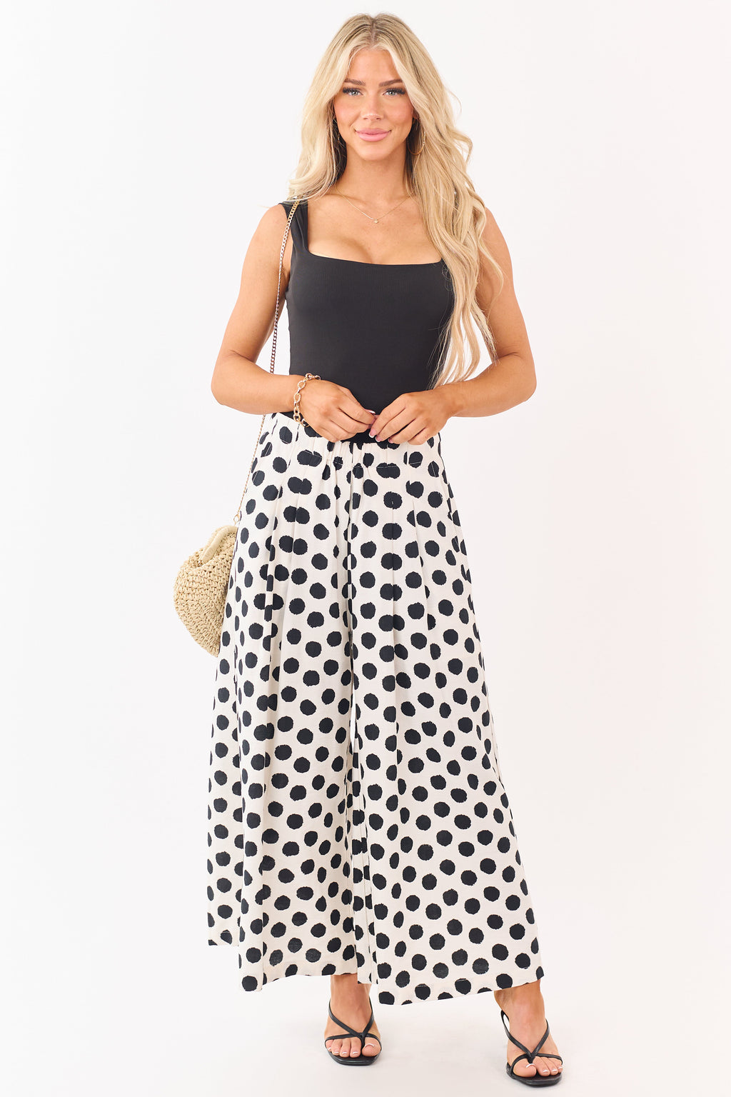 Pantalones anchos chic de color crema con lunares negros