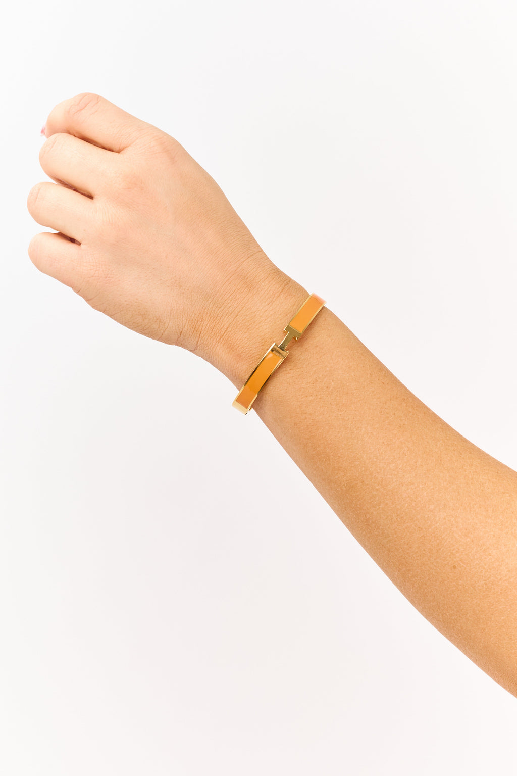 Pulsera de esmalte dorada con bisagra