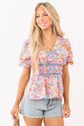 Top de algodón malva con estampado floral y peplum con cintura fruncida